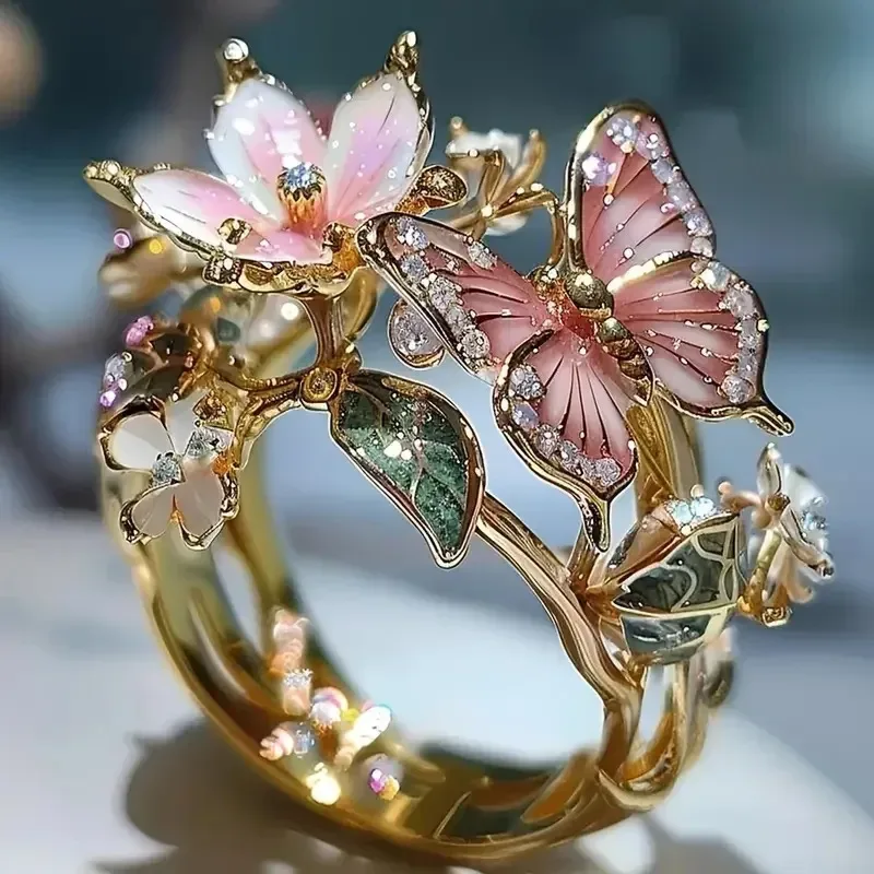 green leaves and blossom on the butterfly scarf ring