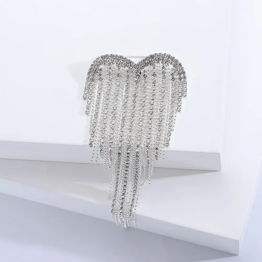 silver tone rhinestone heart outline of the tassel brooch