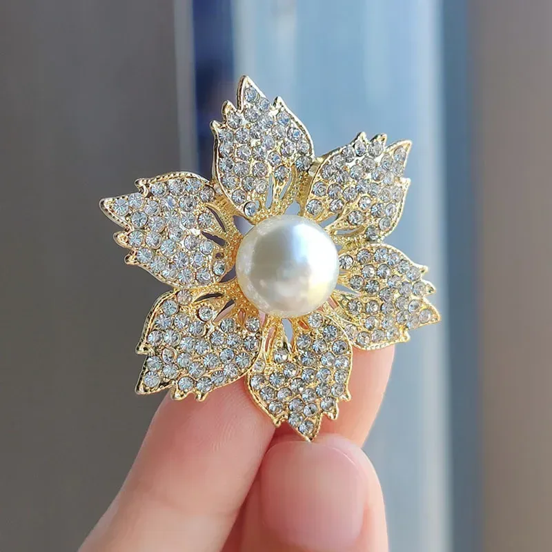 faux pearl center of the rhinestone flower brooch