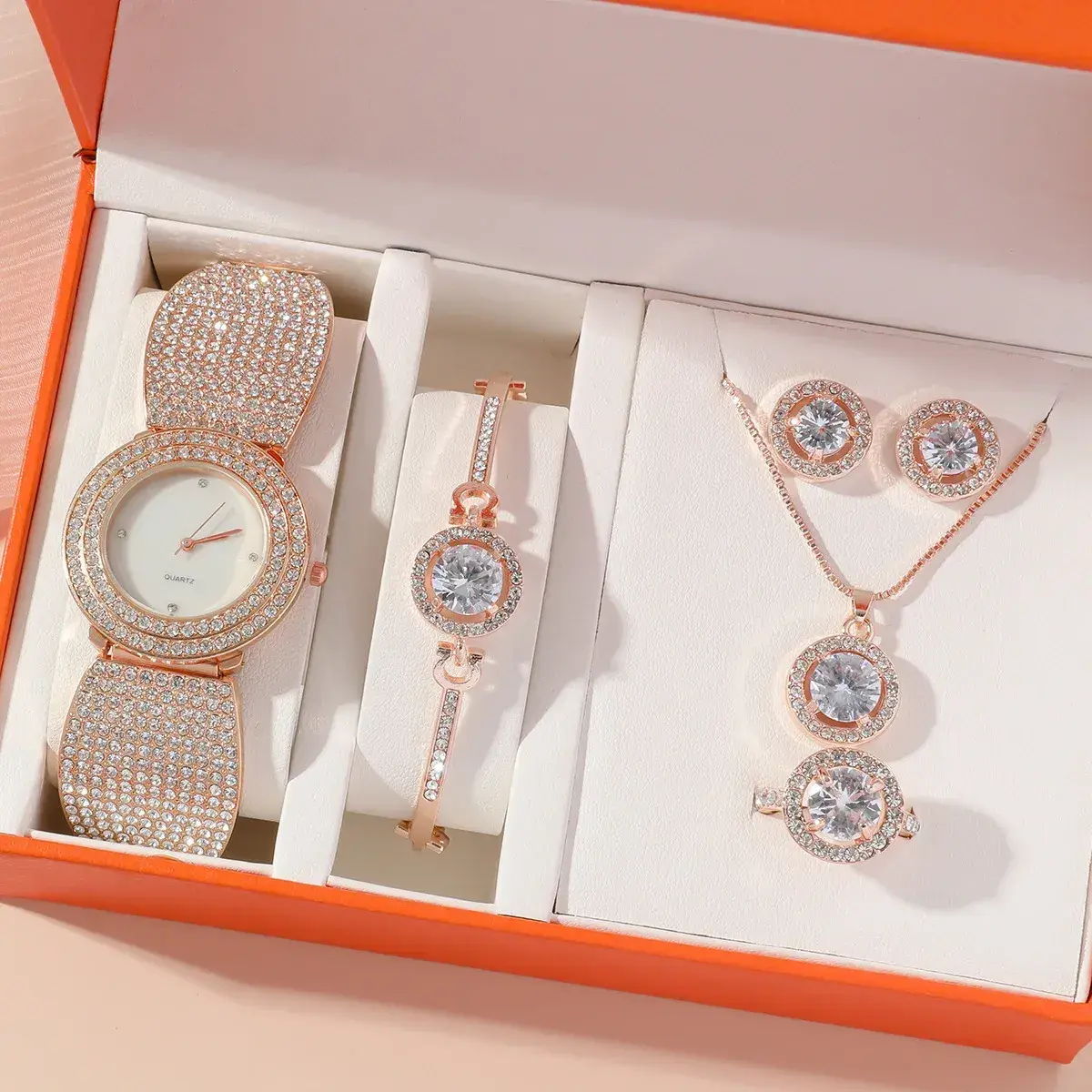 rhinestone watch and jewelry set arranged in its gift box