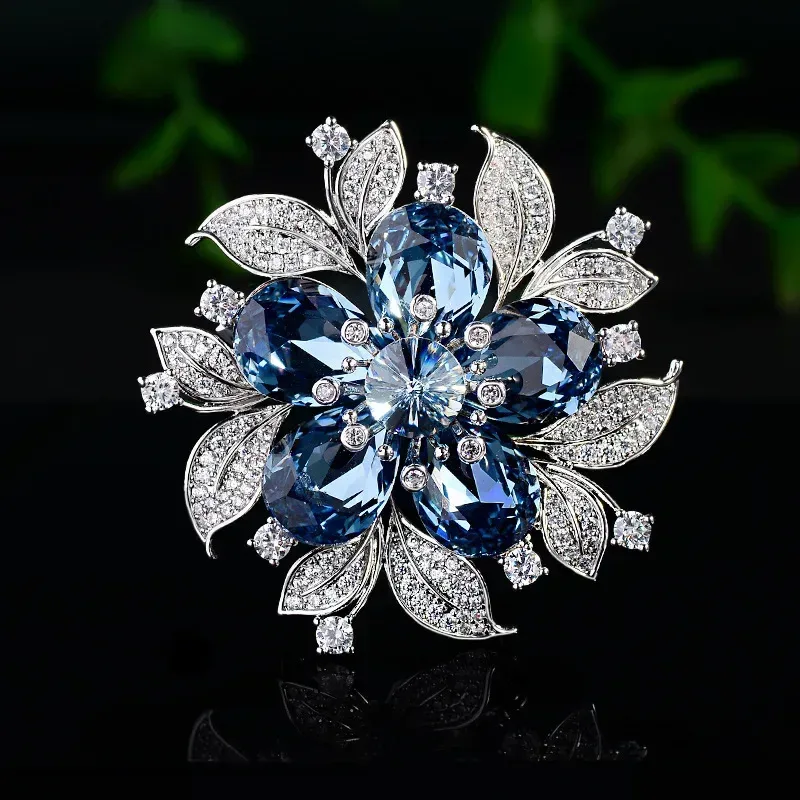 blue and silver tone rhinestone flower brooch