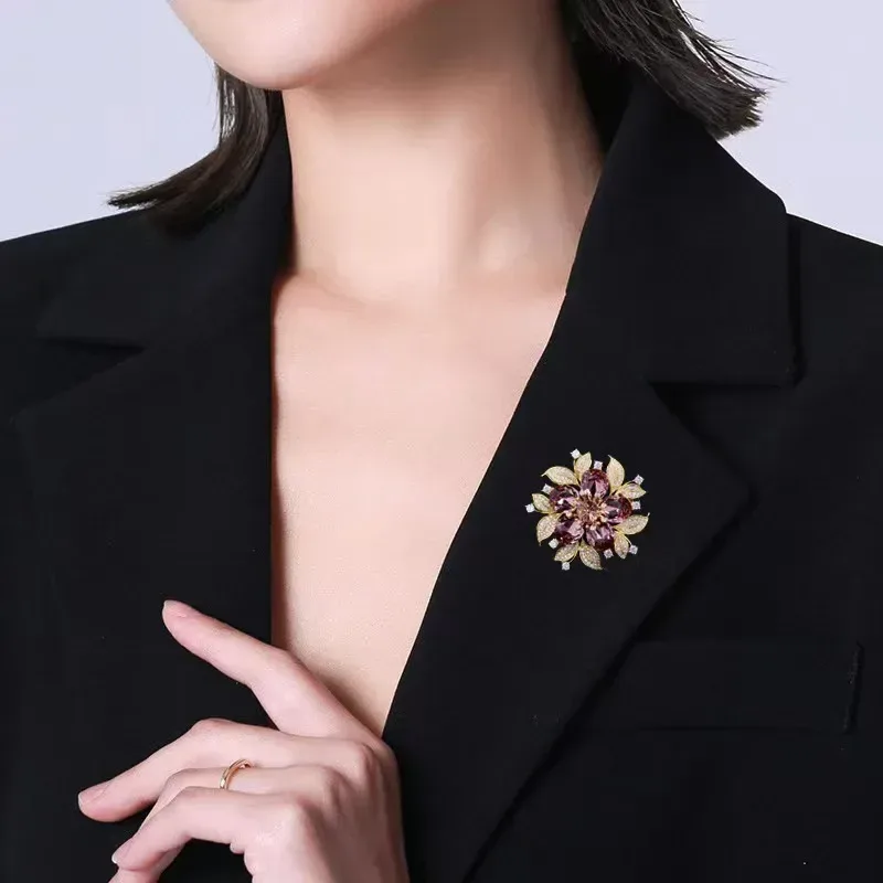 rhinestone flower brooch pinned to a jacket lapel
