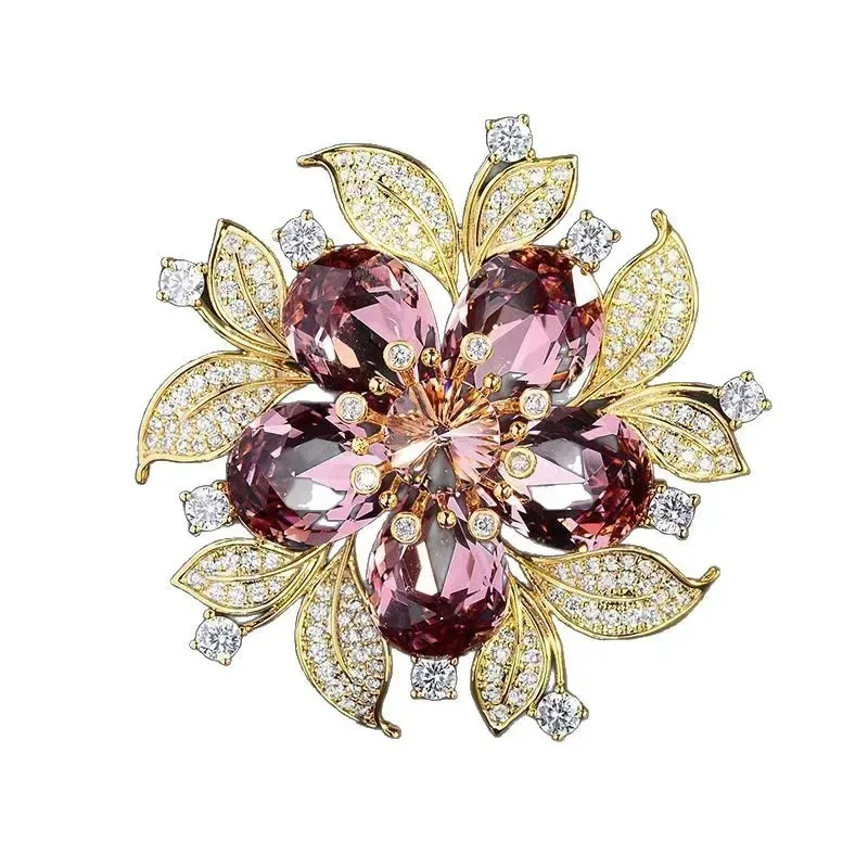 rhinestone leaves around the flower brooch