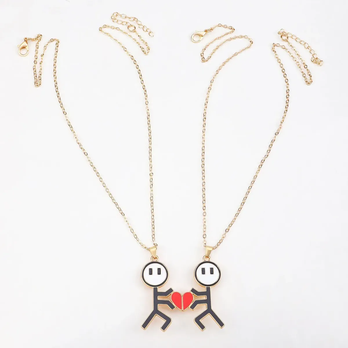 gold tone matching couple necklaces at full chain length