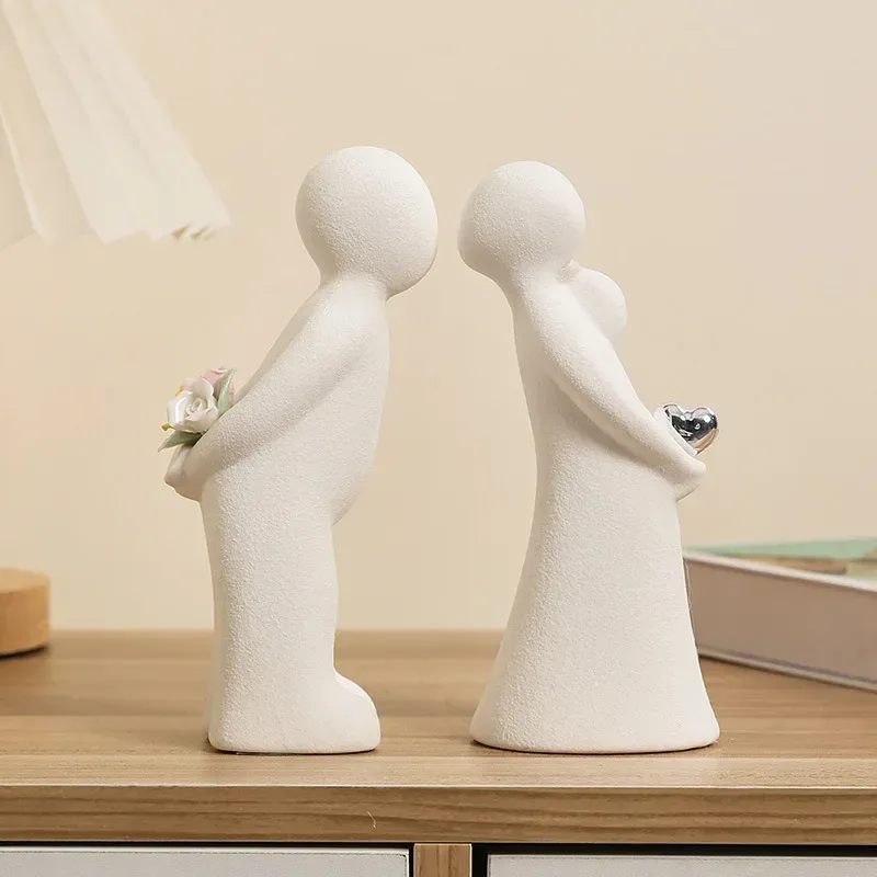kissing couple ceramic figurines on a wooden shelf