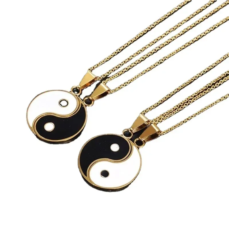 gold tone yin yang couple necklace detail