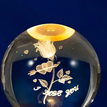 close up of the rose and hearts laser engraved inside the crystal ball night light