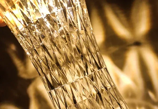 faceted diamond pattern of the crystal table lamp lit up