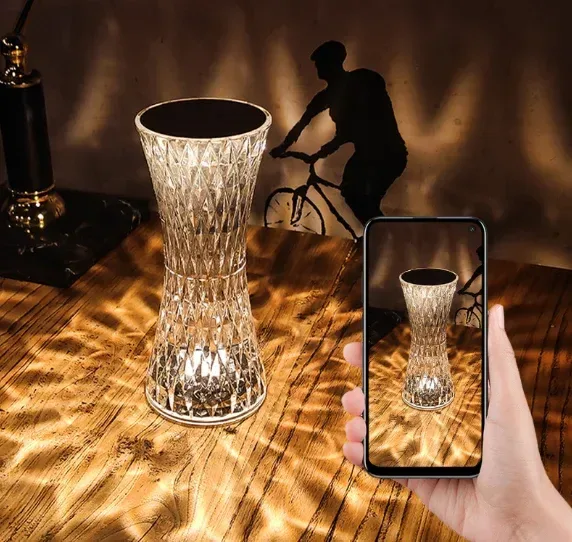 rechargeable crystal table lamp throwing light patterns on the wall