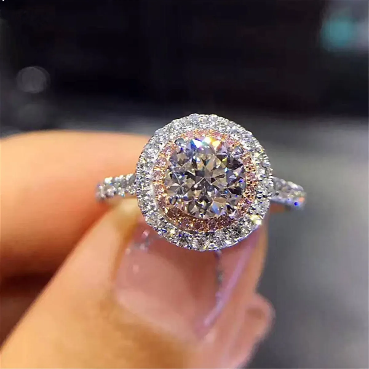 round cubic zirconia center stone framed by a double halo