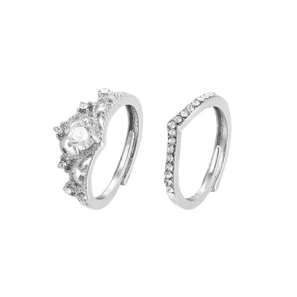 crown ring set showing the open adjustable backs of both rings