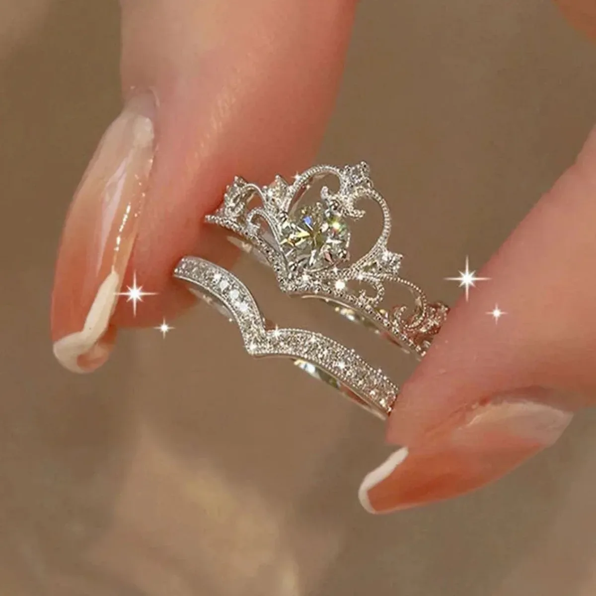 rhinestone detail on the crown ring set in silver tone