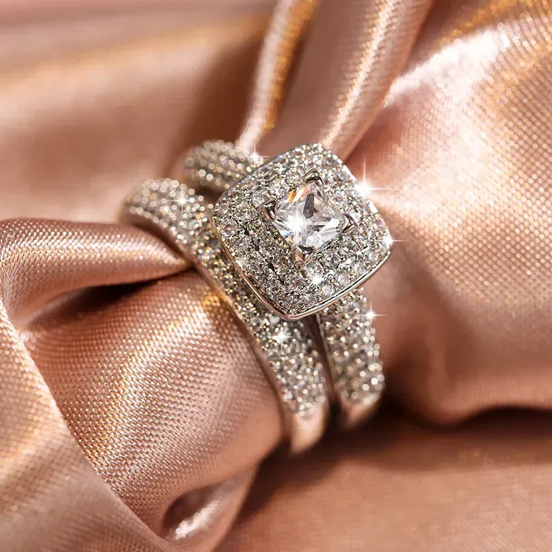 square halo cubic zirconia bridal ring set on pink satin