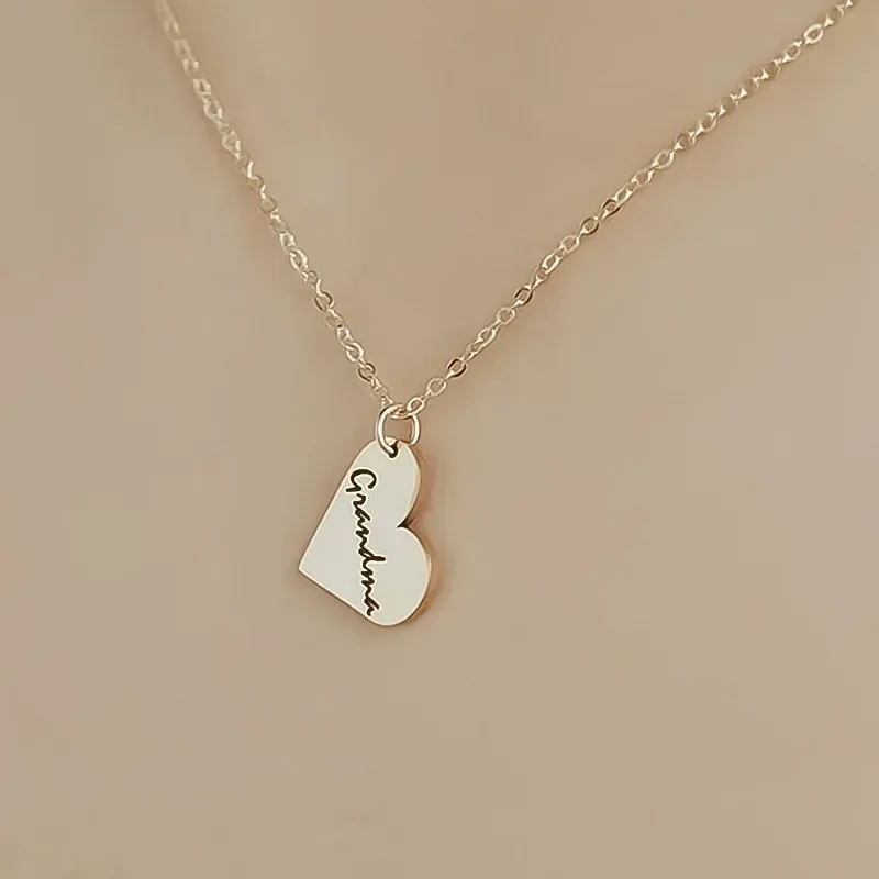 engraved heart charm with the word Grandma