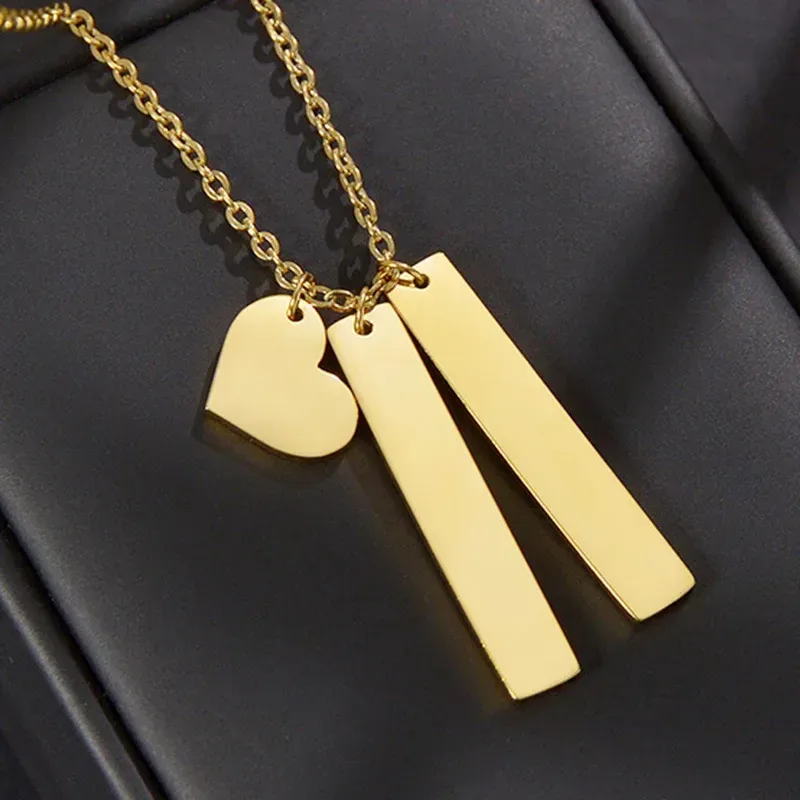 heart and two bars on a fine gold tone chain
