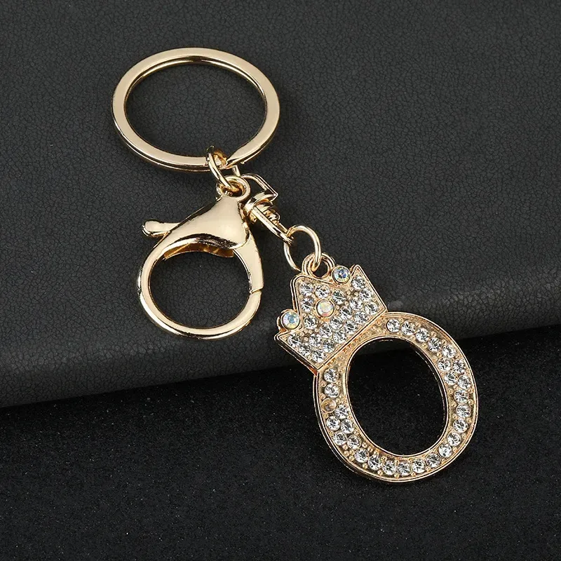 letter O gold tone rhinestone keychain