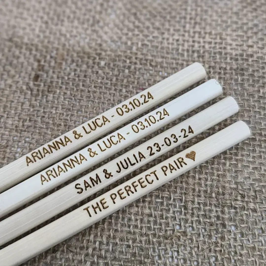 light bamboo chopsticks with engraved text