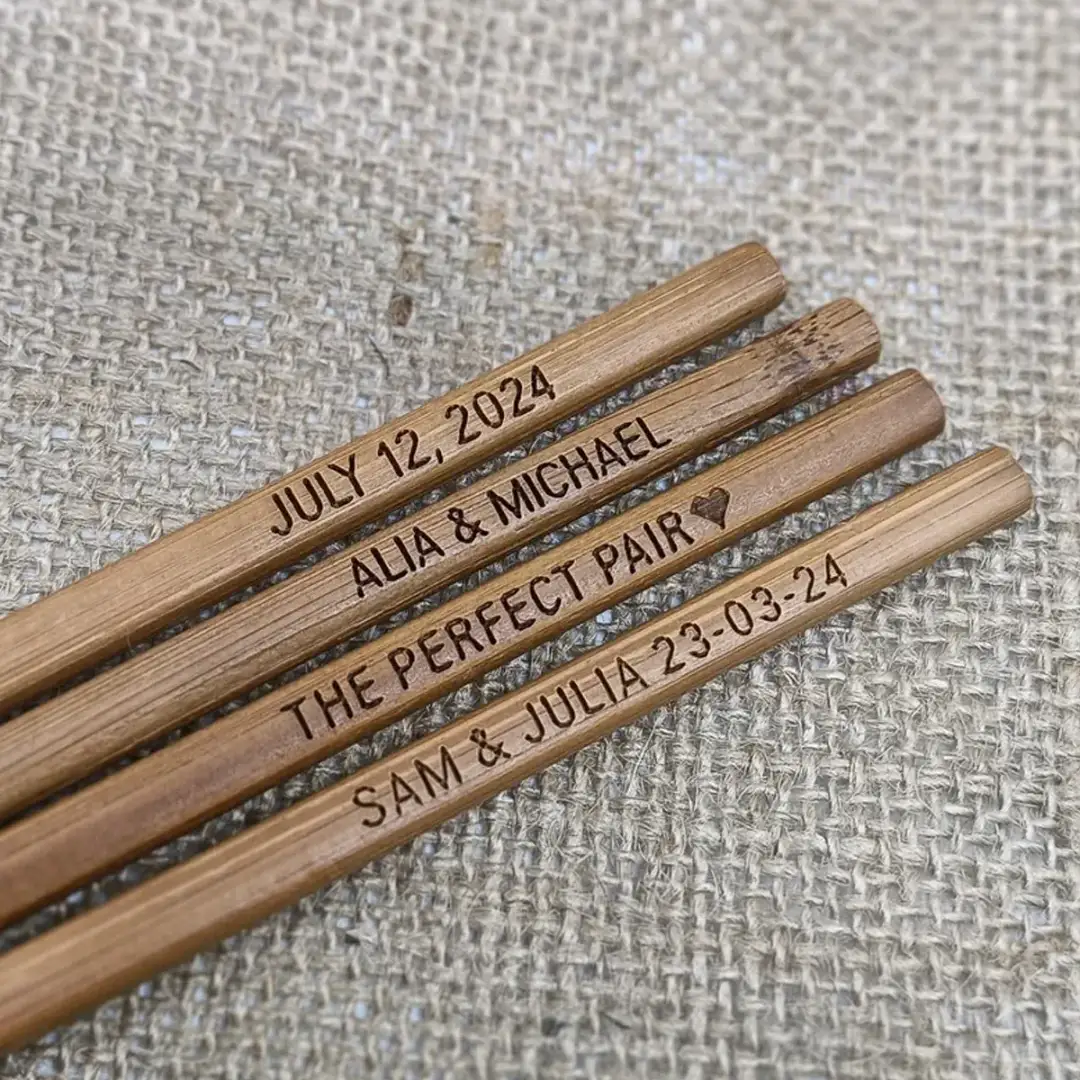 bamboo chopsticks engraved with names and a date