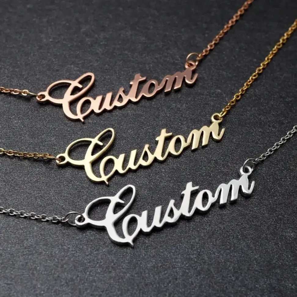three name necklaces layered in three tones